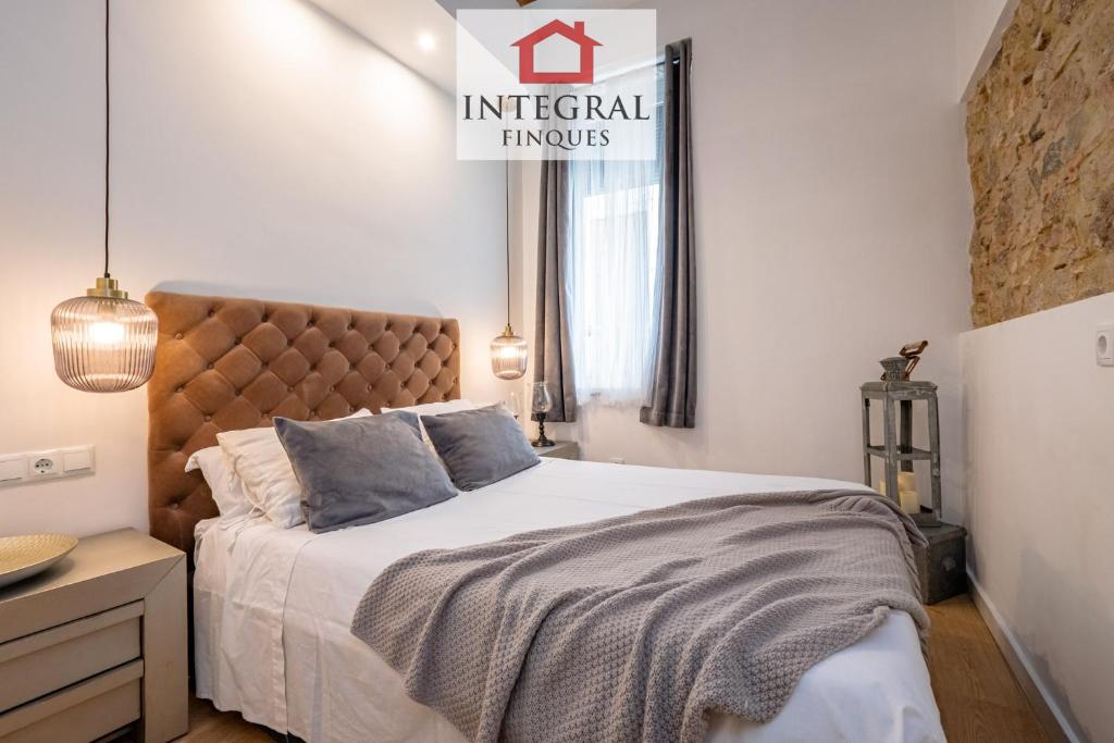 Posteľ alebo postele v izbe v ubytovaní Apartaments Ca la Somiada