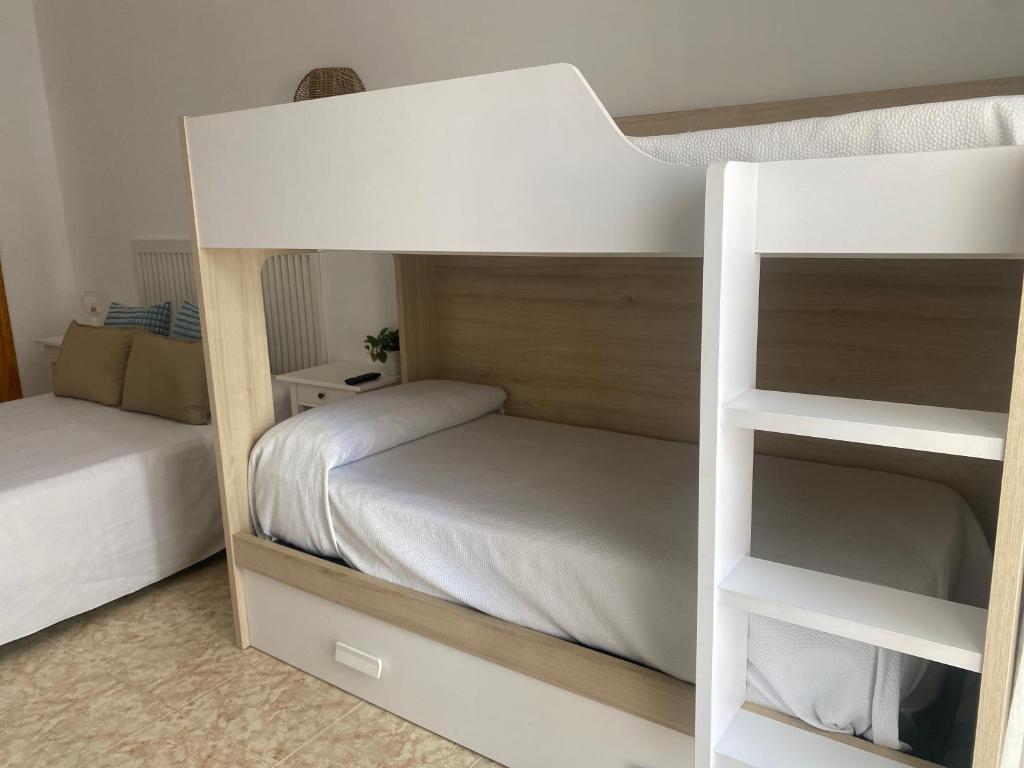 Postel nebo postele na pokoji v ubytování Hostal Andalucia