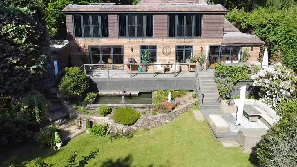 an aerial view of a house with a garden at Stunning Surrey Hills Country House set in half an acre in Hindhead