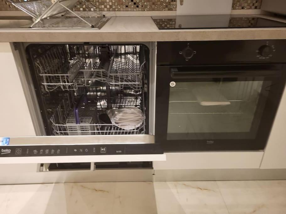 Kuchyň nebo kuchyňský kout v ubytování Duplex neuf 2 chambres HUY