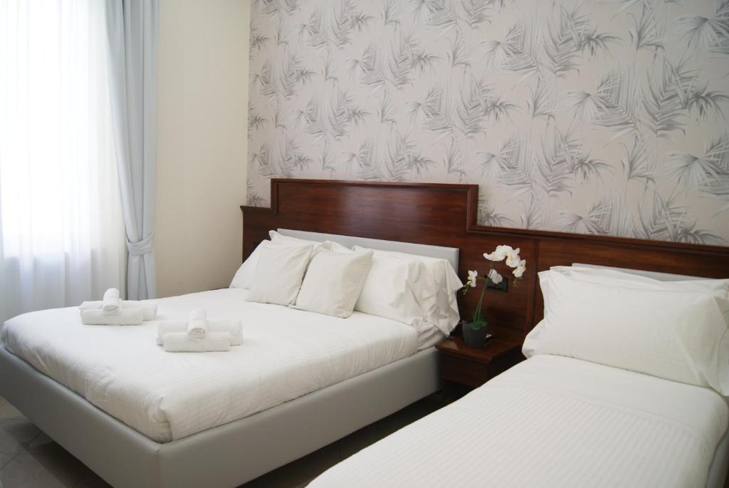 Postel nebo postele na pokoji v ubytování Monti 66 Hotel