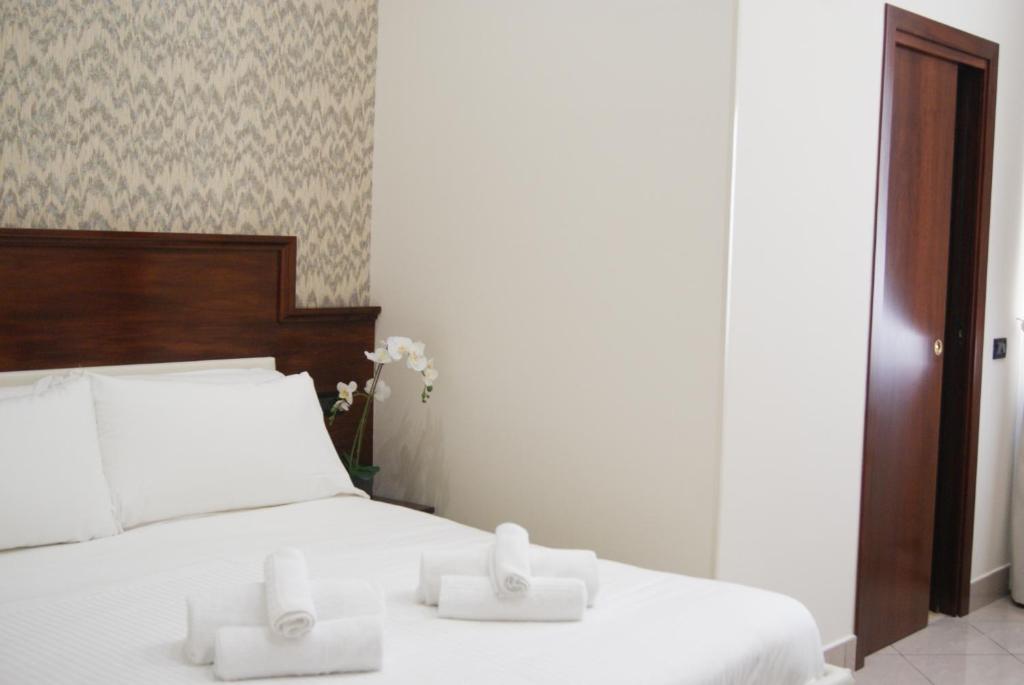 Postel nebo postele na pokoji v ubytování Monti 66 Hotel
