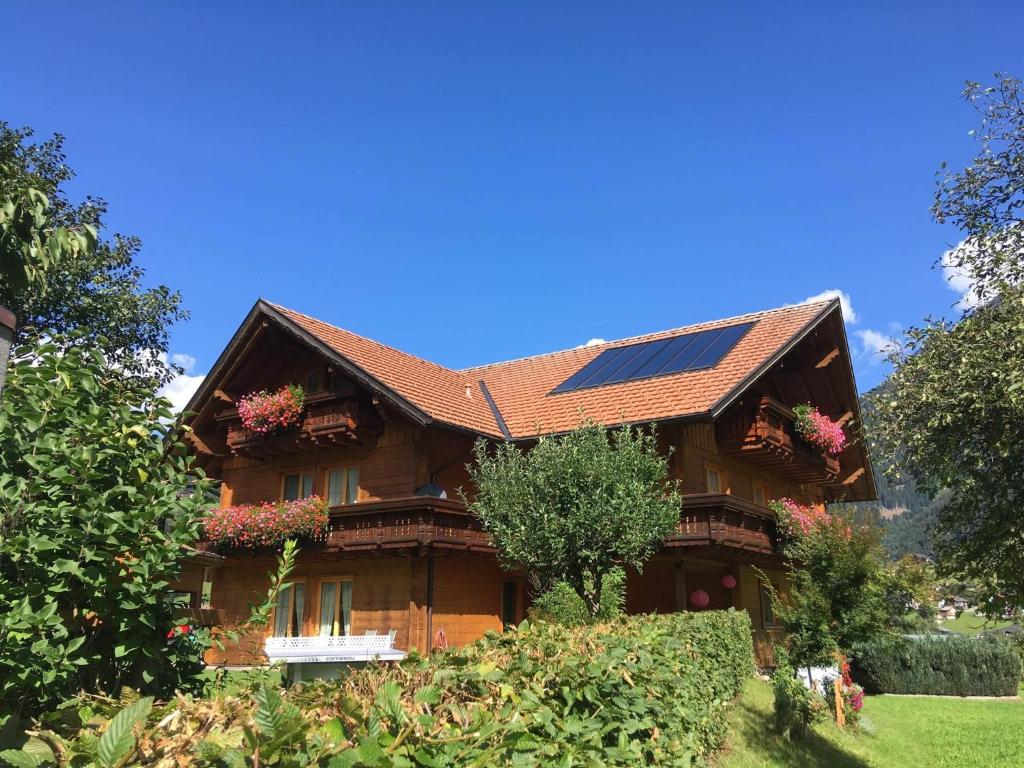 a house with solar panels on the roof at Landhaus Dajana in Gaschurn