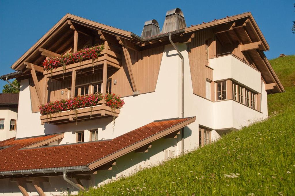 a building with flower boxes on the side of it at Appartement Montanea in Tschagguns