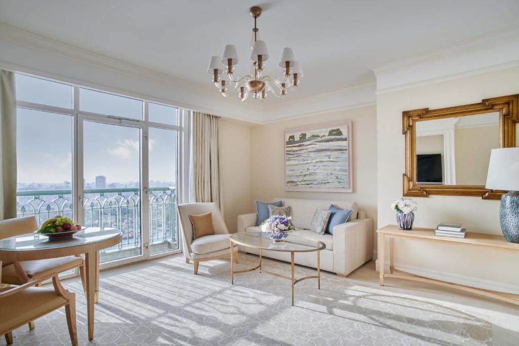 a living room with a couch and a table at Four Seasons Hotel Cairo at Nile Plaza in Cairo