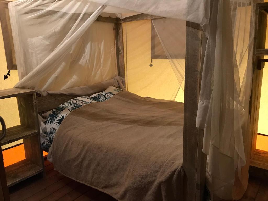 Postel nebo postele na pokoji v ubytování SUZE LUXE NATURE