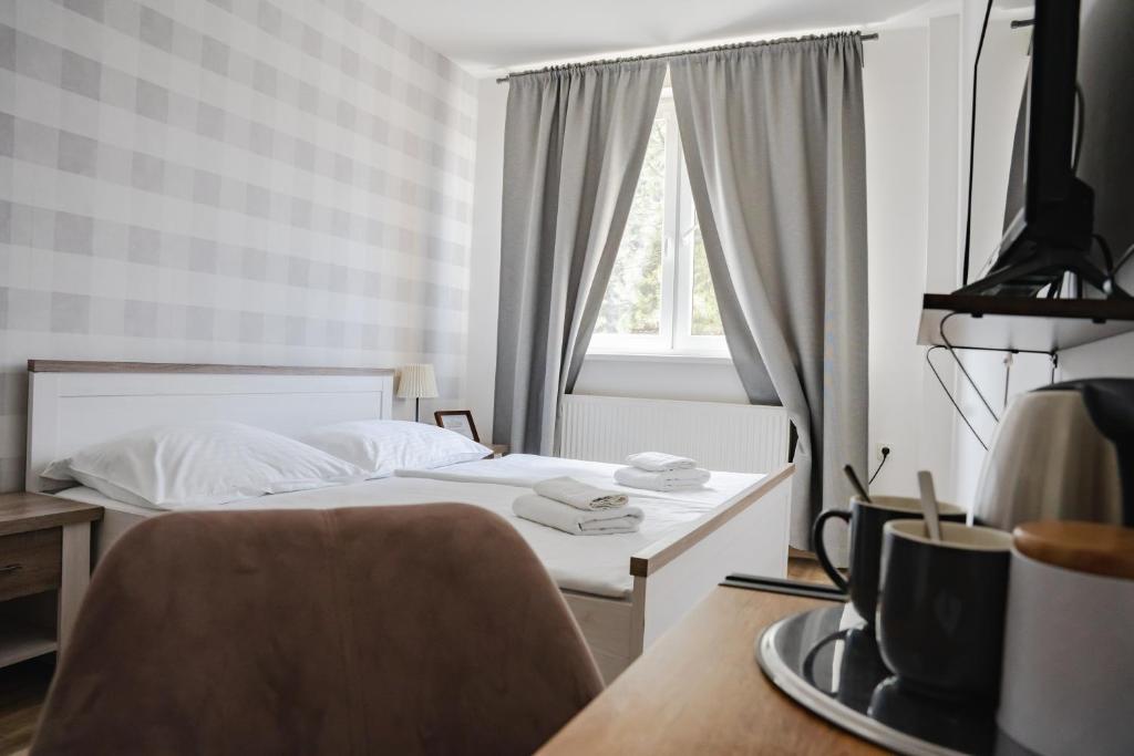 Postel nebo postele na pokoji v ubytování Hotel Arko