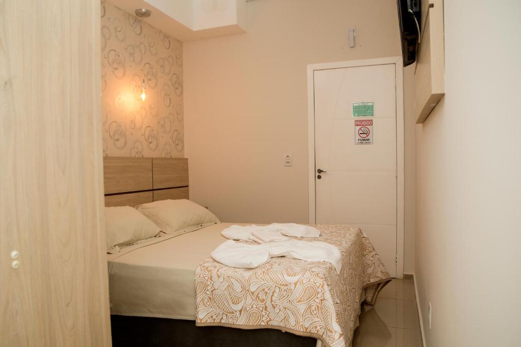 Postel nebo postele na pokoji v ubytování HN-Hotel Natal Penha
