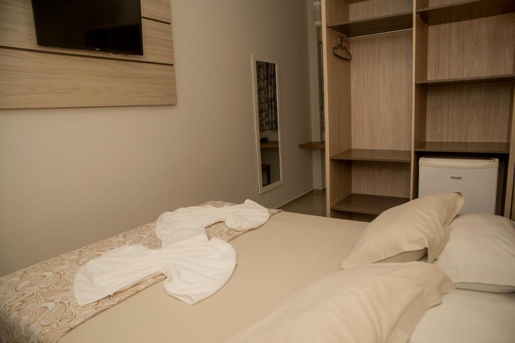 Postel nebo postele na pokoji v ubytování HN-Hotel Natal Penha
