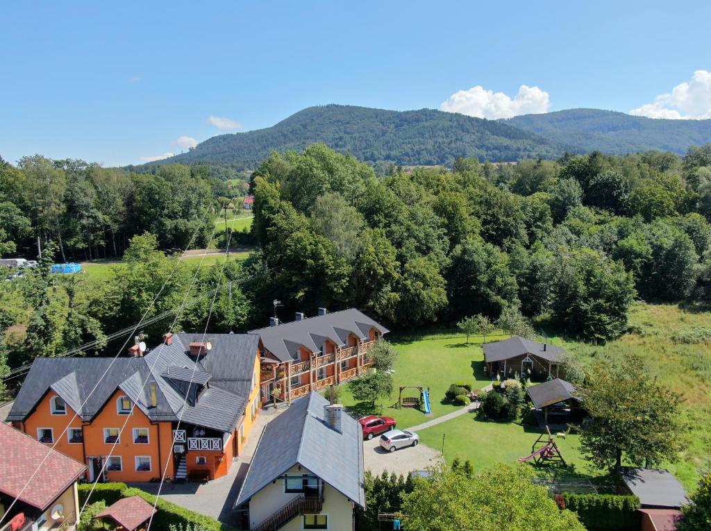 an aerial view of a resort with mountains in the background at Gosciniec Pod Brzegiem in Ustroń