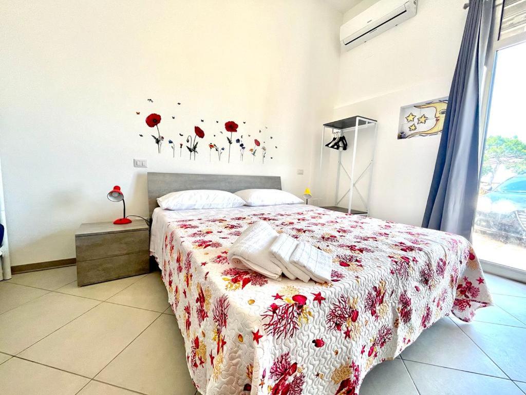 Кровать или кровати в номере Casamare 2