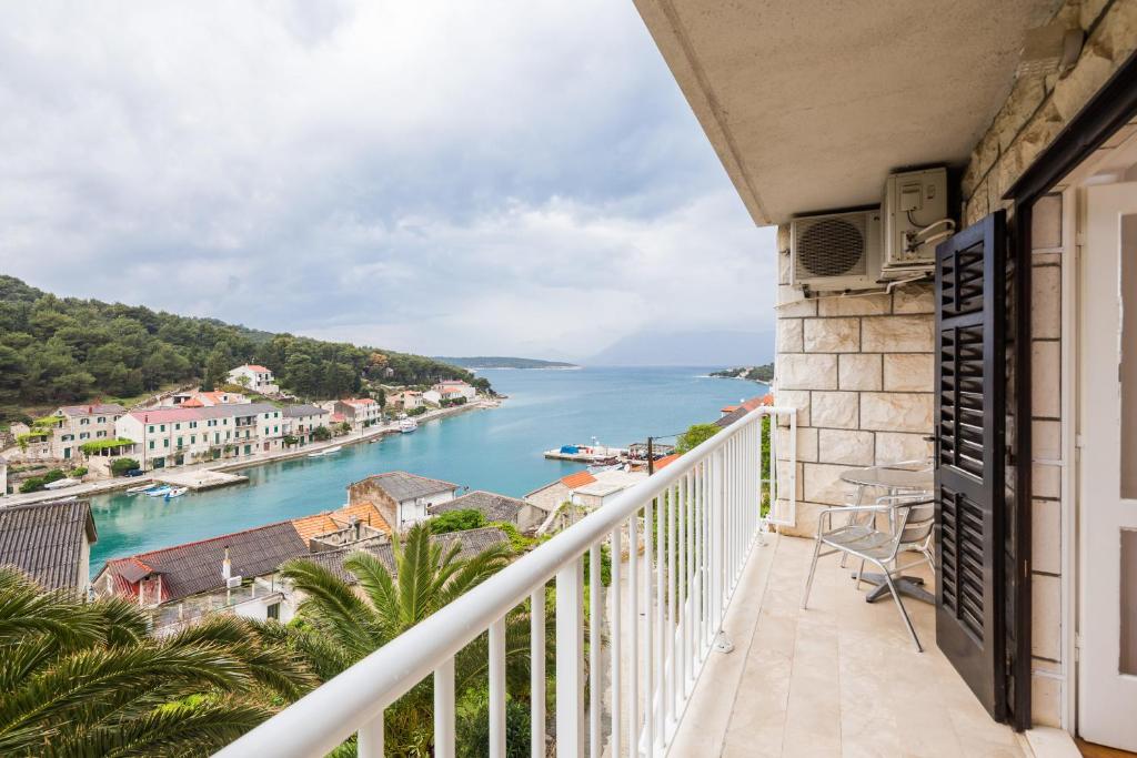 a balcony with a view of the water at Apartments Maria in Povlja