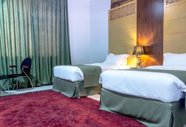 Letto o letti in una camera di Doha Dynasty Hotel