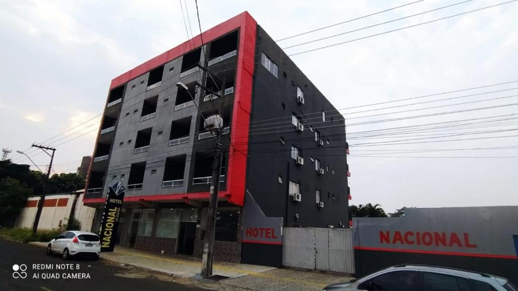 a large building with a red and black at hotel nacional palace in Foz do Iguaçu