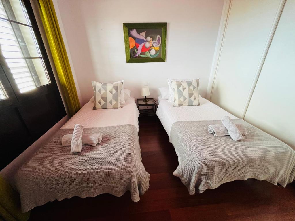 A bed or beds in a room at Casa Lola
