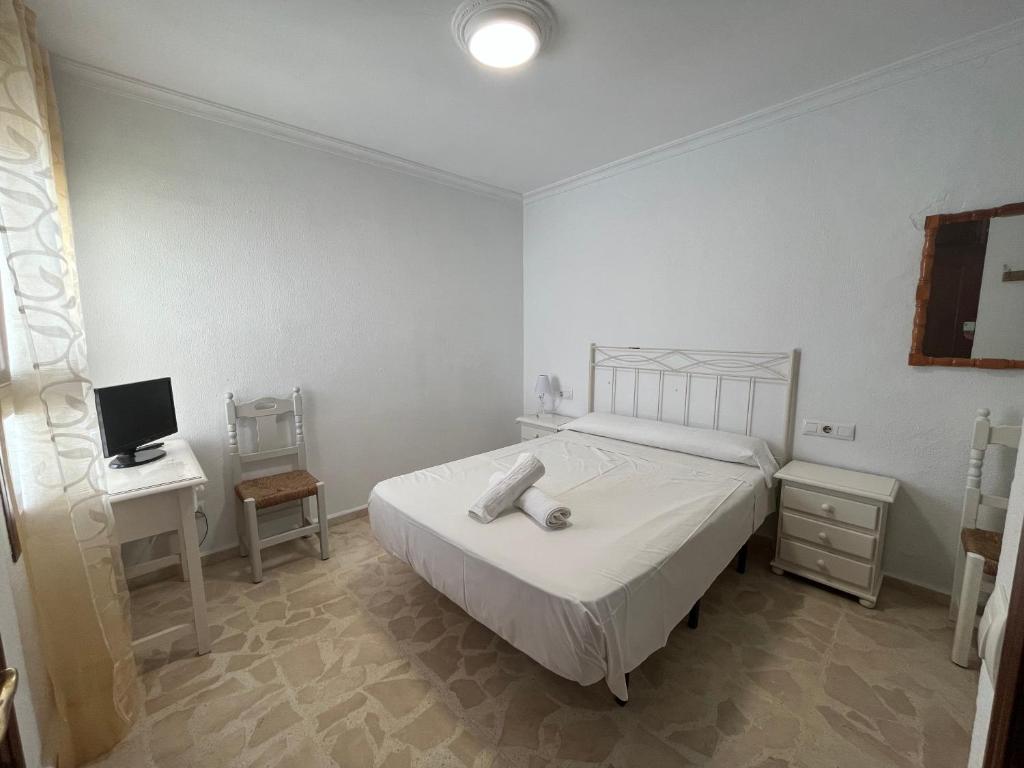 Postel nebo postele na pokoji v ubytování Hostel Conil