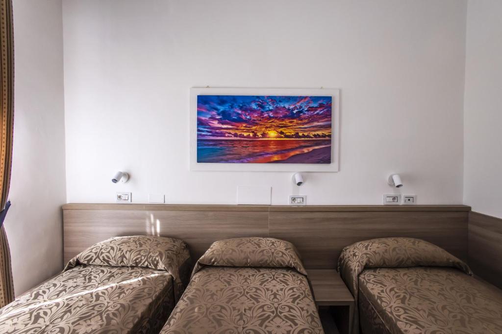 Postel nebo postele na pokoji v ubytování Hotel Orbis