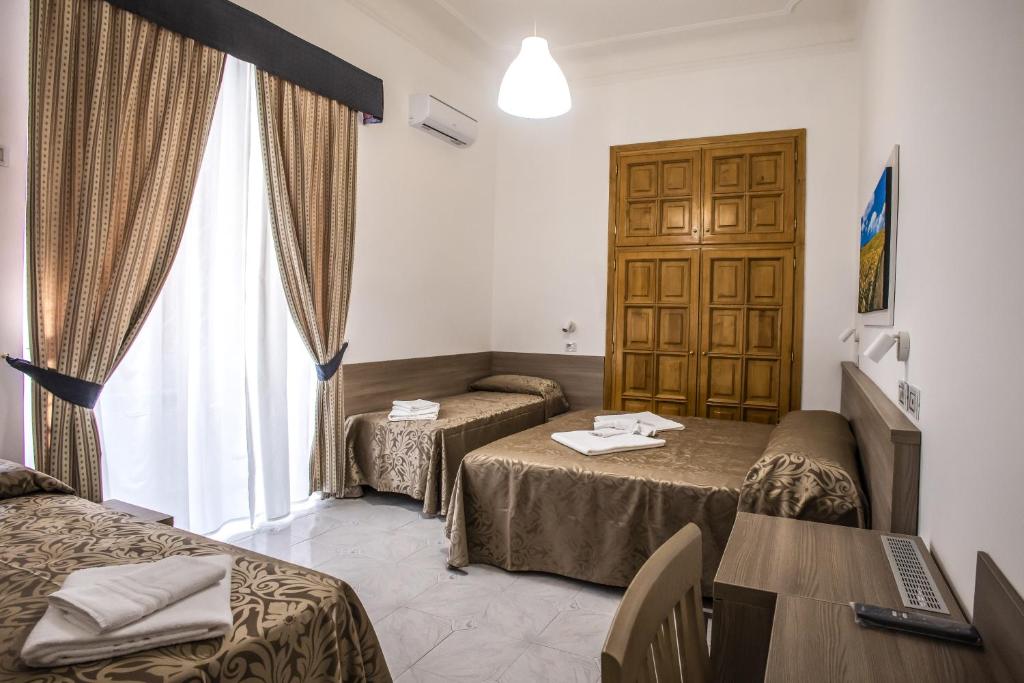 Postel nebo postele na pokoji v ubytování Hotel Orbis