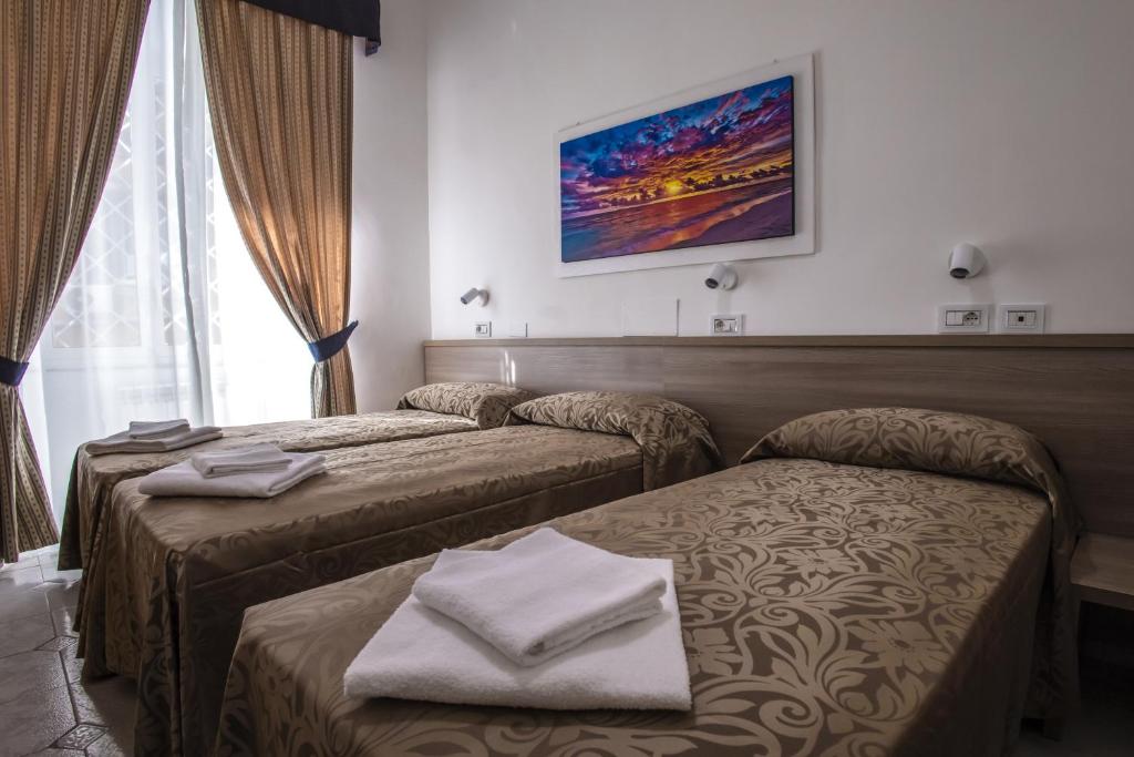 Postel nebo postele na pokoji v ubytování Hotel Orbis