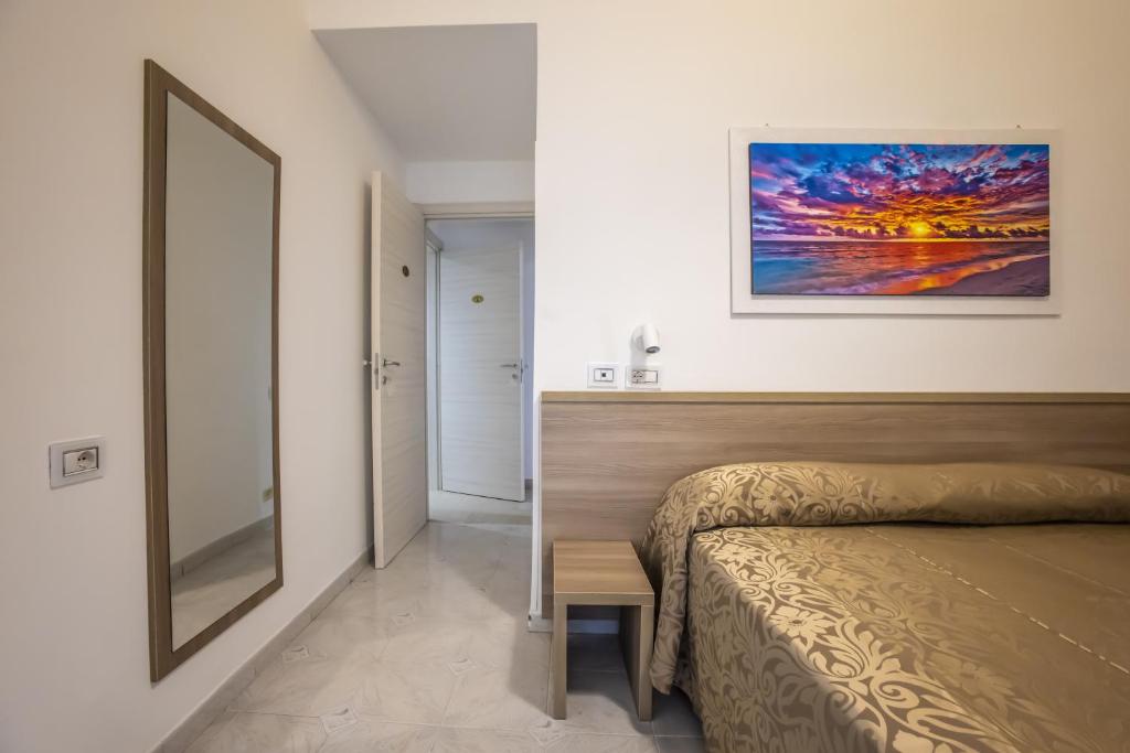 Postel nebo postele na pokoji v ubytování Hotel Orbis