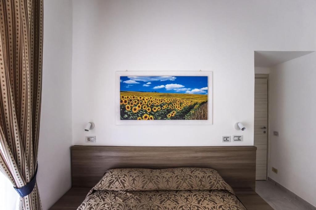 Postel nebo postele na pokoji v ubytování Hotel Orbis