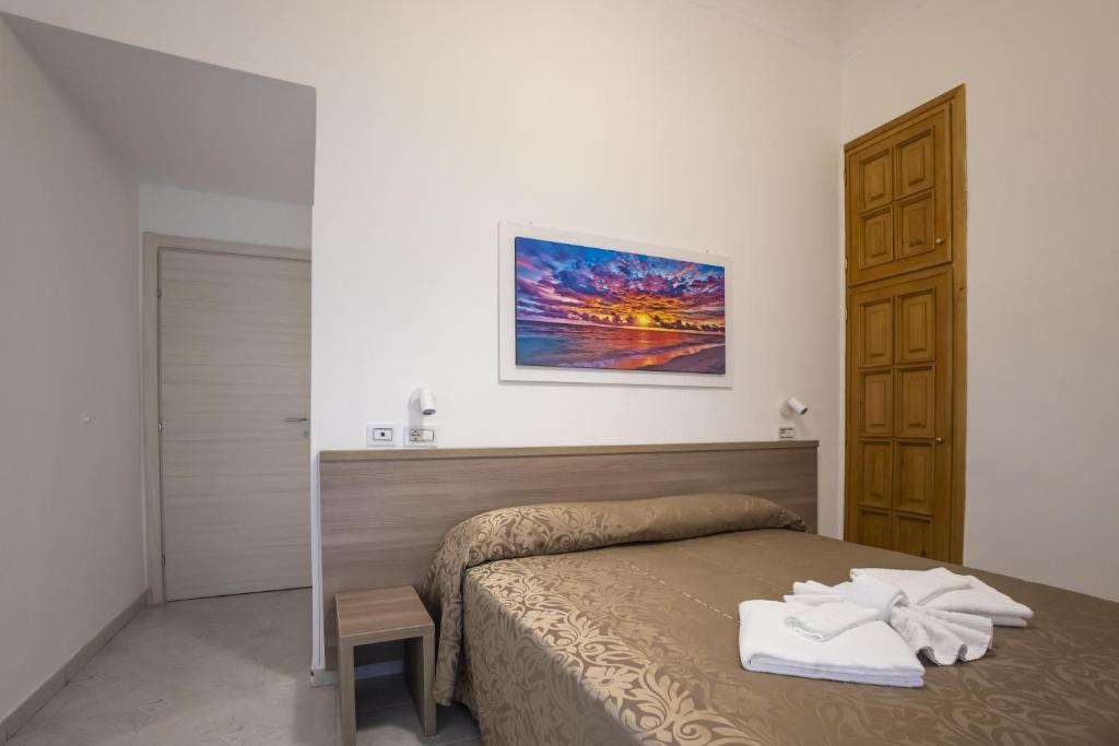 Postel nebo postele na pokoji v ubytování Hotel Orbis