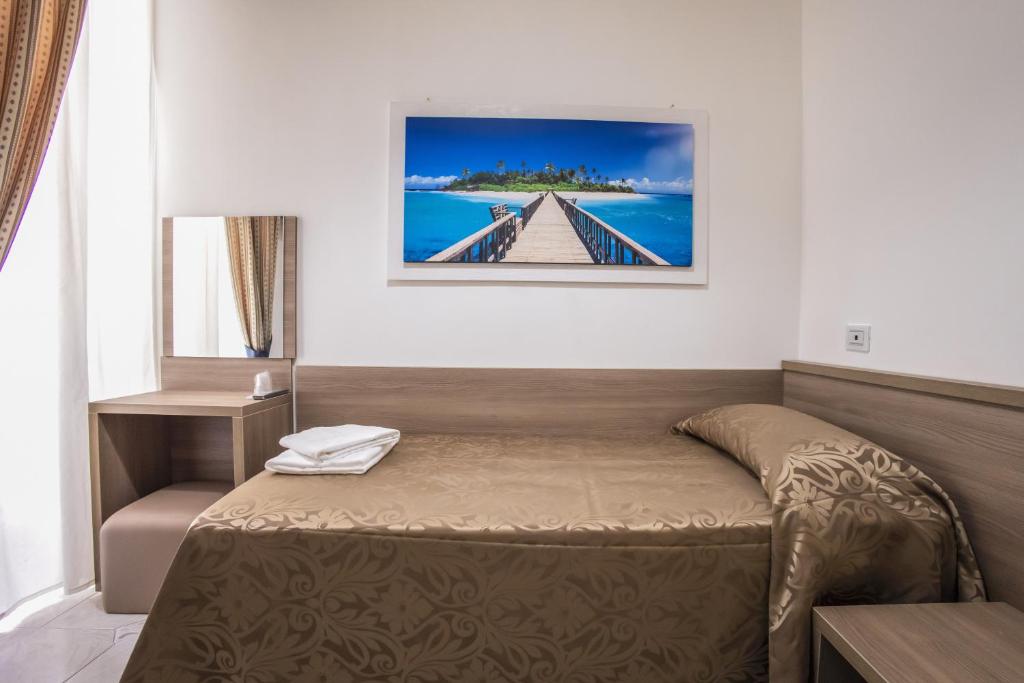 Postel nebo postele na pokoji v ubytování Hotel Orbis