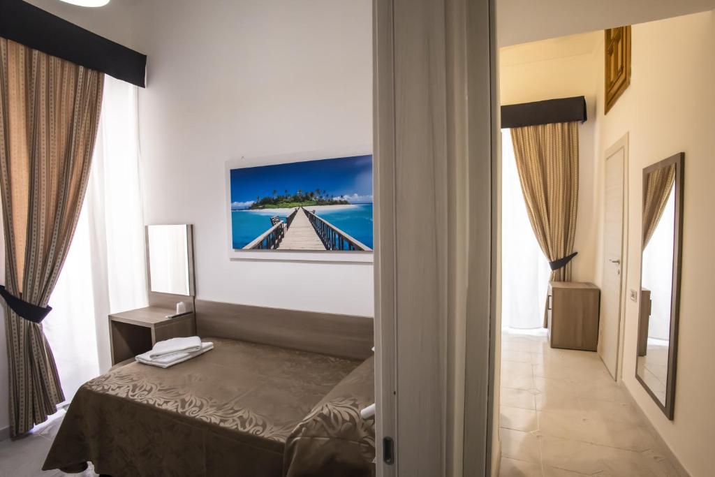 Postel nebo postele na pokoji v ubytování Hotel Orbis