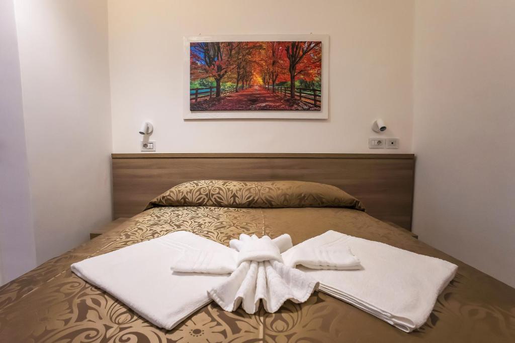 Postel nebo postele na pokoji v ubytování Hotel Orbis
