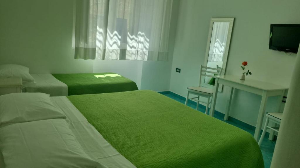 Postel nebo postele na pokoji v ubytování Albergo S. Andrea