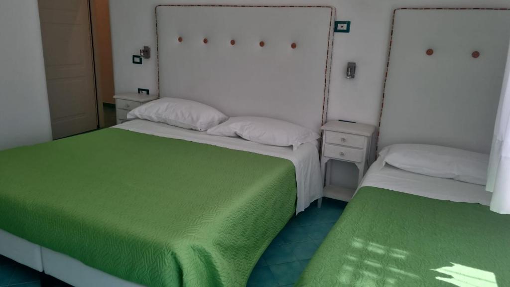 Postel nebo postele na pokoji v ubytování Albergo S. Andrea