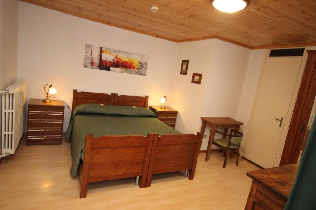 Postel nebo postele na pokoji v ubytování Hotel Col Du Mont