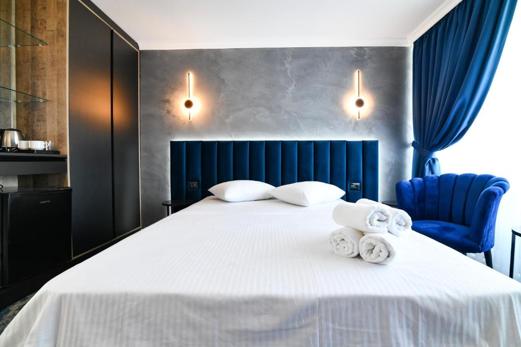 Postel nebo postele na pokoji v ubytování HOTEL TOPAZ 4* CAP AURORA
