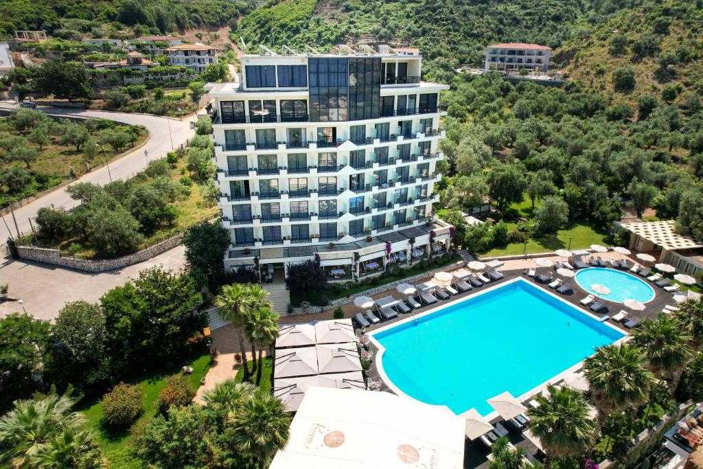 an aerial view of a hotel with a swimming pool at Rapo's Resort Hotel in Himare