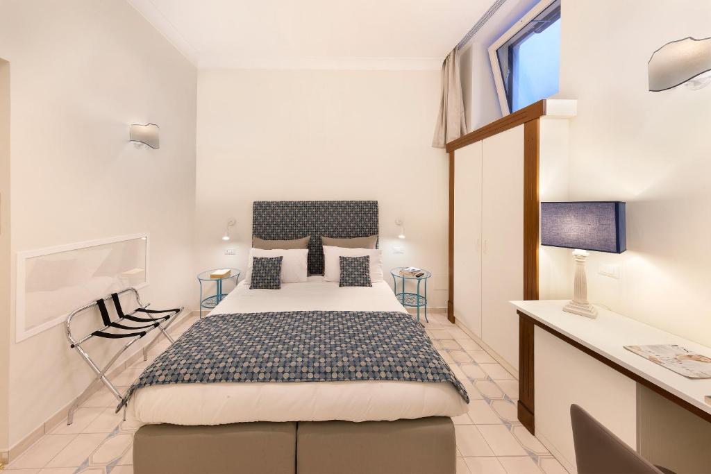 Postel nebo postele na pokoji v ubytování Rosa Magra Guest House