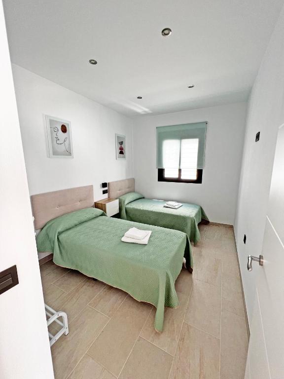 Postel nebo postele na pokoji v ubytování BAMBÚ SUP · Casa rural en Vejer con piscina privada