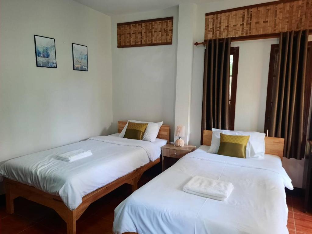 Postel nebo postele na pokoji v ubytování Hotel Pailifornia