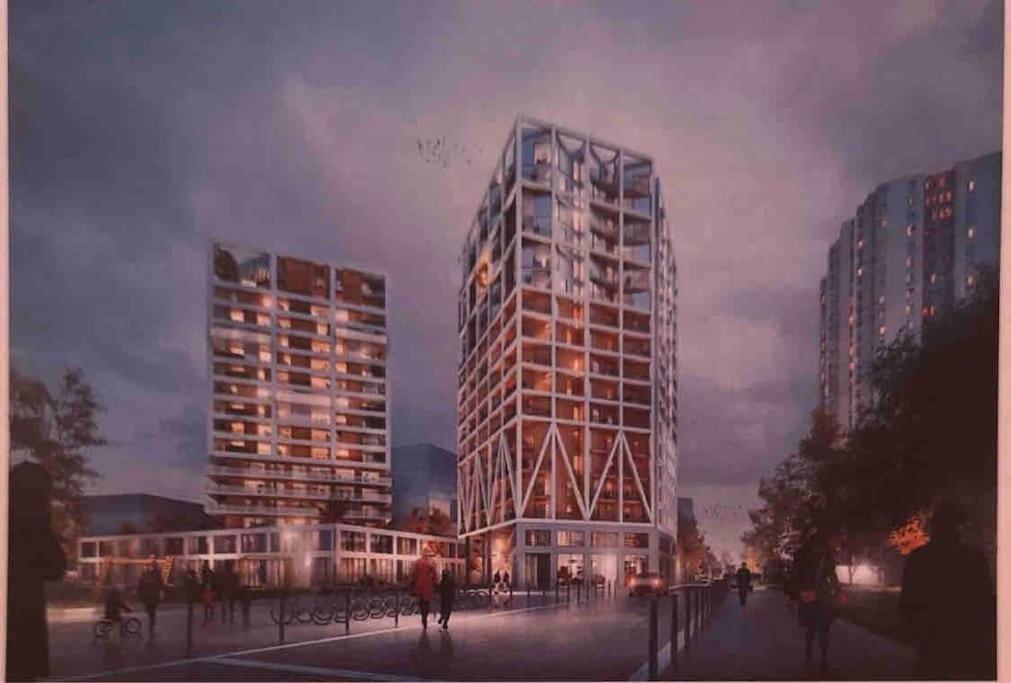 un montage d'un grand bâtiment dans une ville dans l'établissement Appart'Hôtels Sacré Cœur Parking Gratuit, à Paris