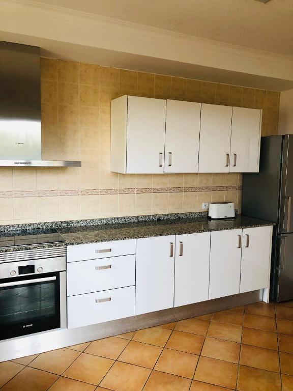 Kuchyň nebo kuchyňský kout v ubytování Chalet Font de Sa Cala