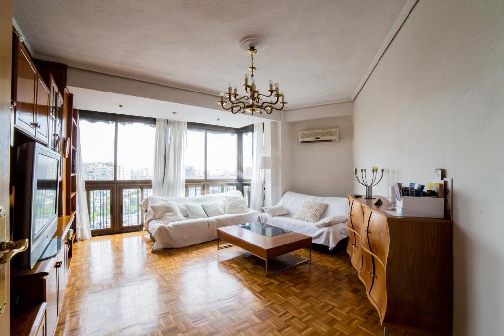 a living room with a couch and a table at Awesome apartment center Valencia in Valencia