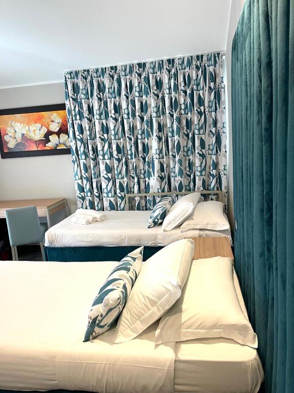 Postel nebo postele na pokoji v ubytování Hotel Sant'Elia