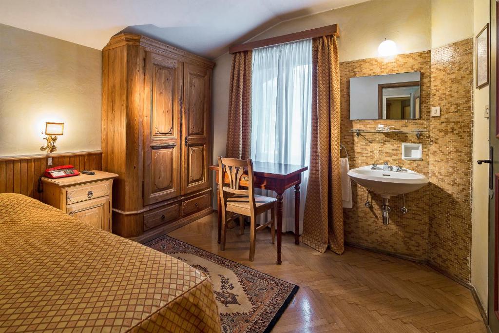 Postel nebo postele na pokoji v ubytování Hotel Corona