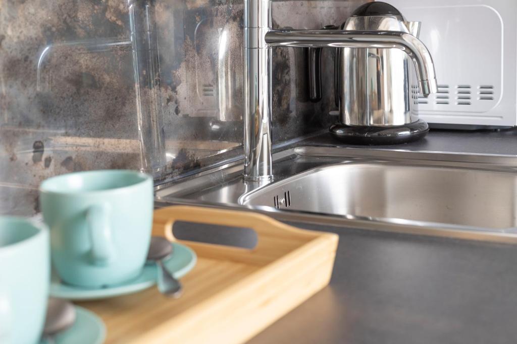 Een keuken of kitchenette bij Olmo Suites
