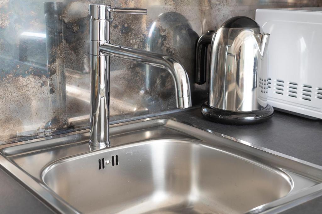 Een keuken of kitchenette bij Olmo Suites