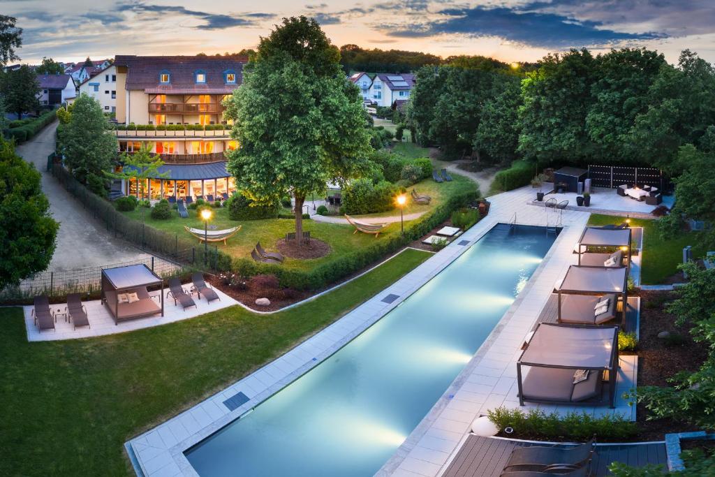 an aerial view of a hotel with a swimming pool at Garden & SPA Hotel Das Götzfried in Regensburg
