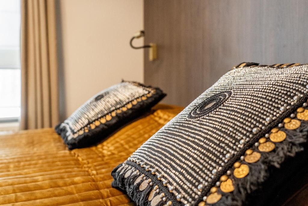 Postel nebo postele na pokoji v ubytování Hotel Veere