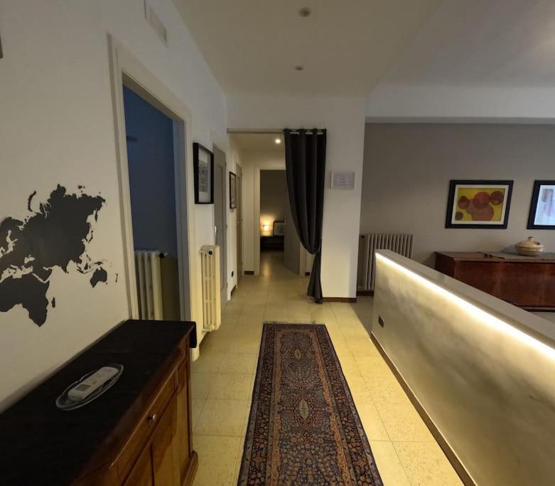a room with a hallway with a long hallway sidx sidx at Ciccimè Sea House in Bari