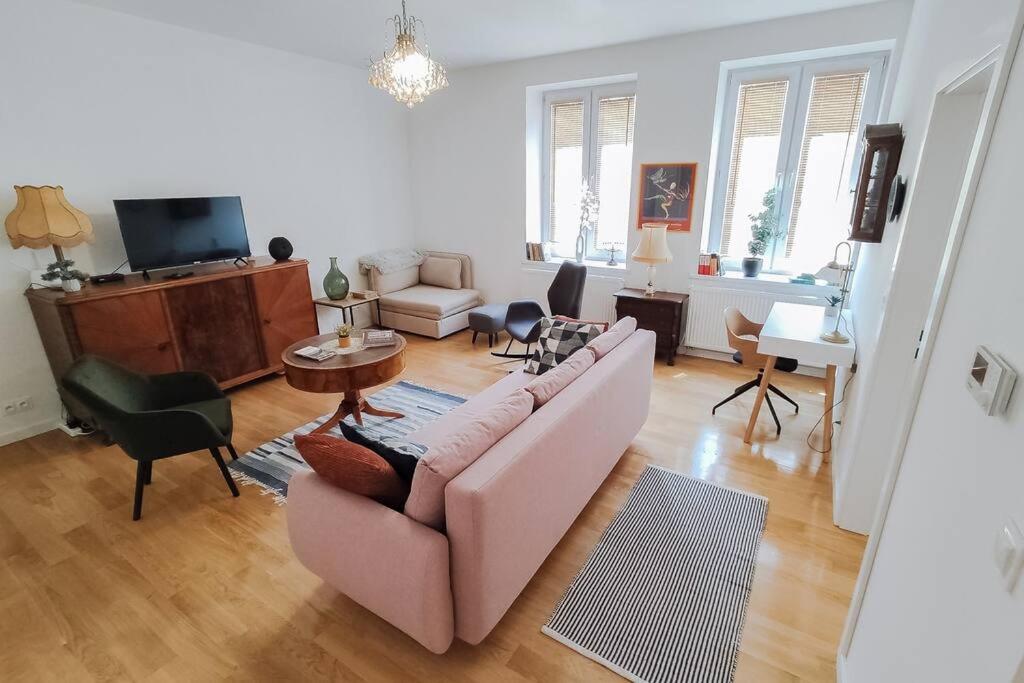 a living room with a couch and a table at Apartment Laizor in Staszów