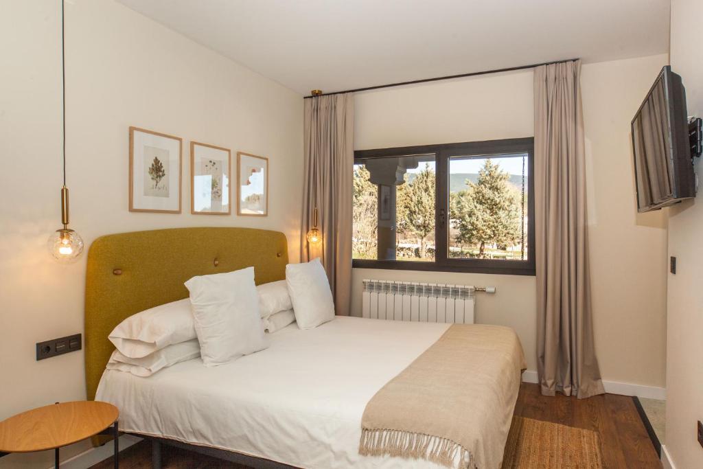 Posteľ alebo postele v izbe v ubytovaní Duruelo Mountain Suites