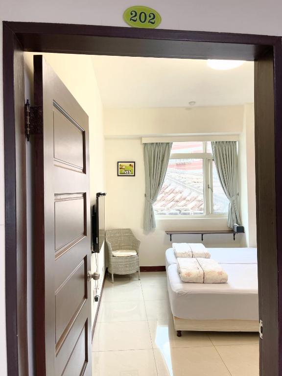 Postel nebo postele na pokoji v ubytování Zucuo Homestay
